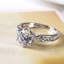 Elegant Round-Cut Solitaire Engagement Ring with Pavé Band – Silver Finish